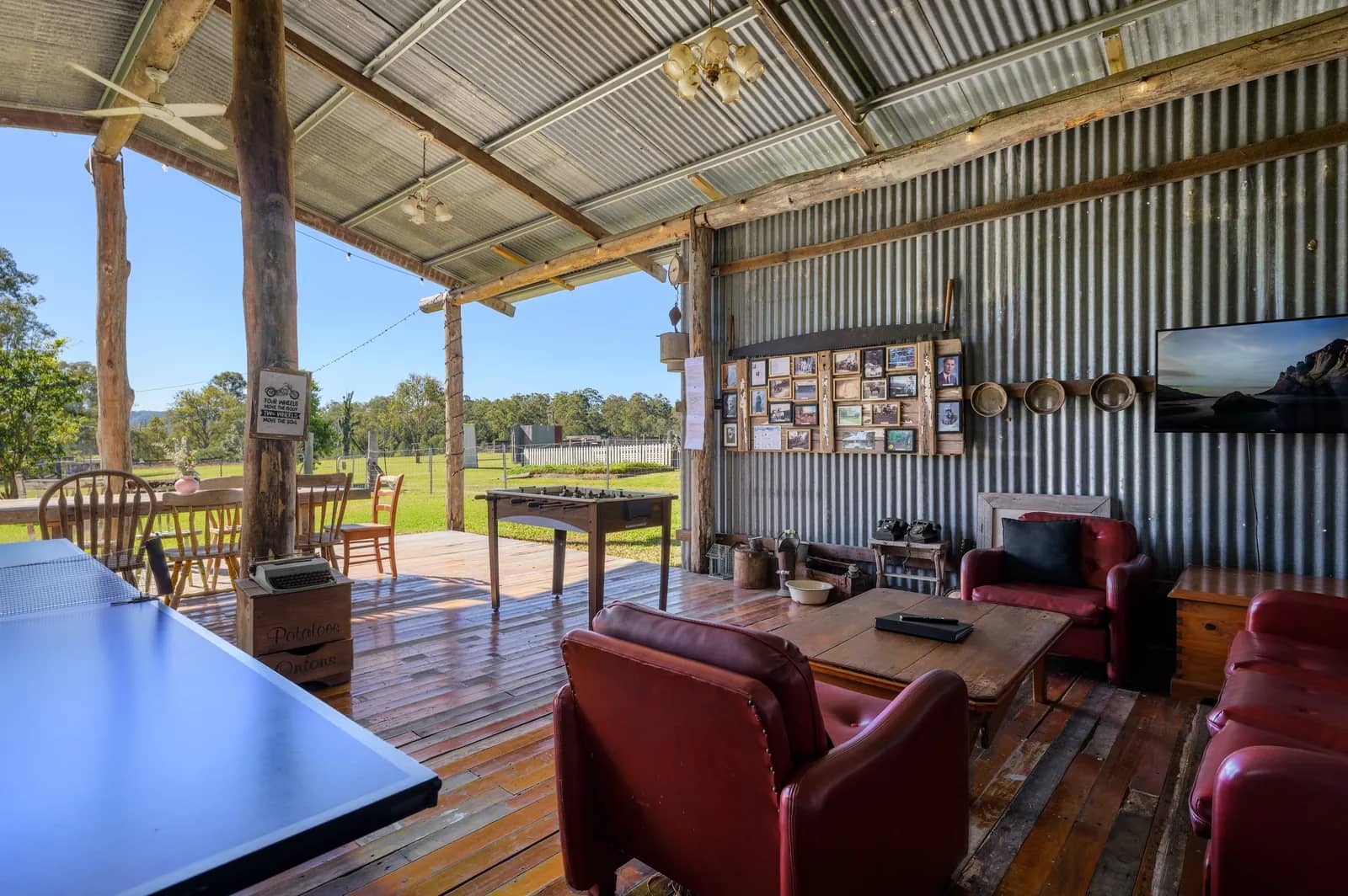 The barn's red leather lounges, table tennis table and open view over the paddock