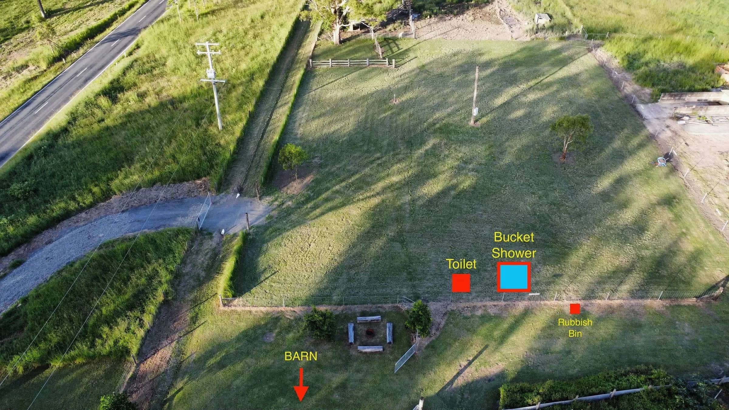 Aerial photo of the paddock showing the toilet, bucket shower, rubbish bin and the way to the barn